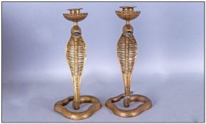 Pair Of Indian Cast Brass Cobra Snake Candlesticks Of Coiling Form, candle mount fitted to the
