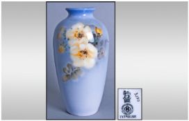 Royal Doulton Hand Painted Titanian Vase, pale blue ovoid vase with a spray of yellow flowers to