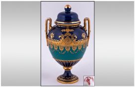 Royal Crown Derby Two Handle Urn Shaped Lidded Vase. Date 1899. Stands 5.5 inches high.