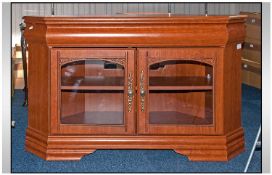 A Contemporary TV Corner Unit with glazed doors to front. 17 inches deep, 40 inches wide.