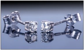 Pair Of Ladies 9ct White Gold Diamond Stud Earrings, set with a single round brilliant cut diamond.