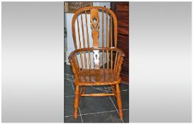 Antique Beech/Ash Windsor Armchair Of Traditional Form Hooped, Splat Back on turned legs.