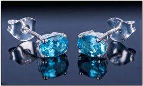 Pair of Paraibe Apatite Stud Earrings, with post and push back fittings; each clear, bright,