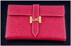 Red Leatherette Ladies Purse, with gold coloured clasp. Complete with outer box, marked Hermes(