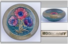 Moorcroft Footed Inverted Small Bowl. Anemone design on green ground. Diameter 5.25 inches.