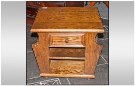 Small Oak Magazine Stand side Cabinet, with a single draw and magazine compartments to the sides.