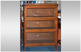 A Wernicke Oak Three Tier Glazed Stacking Book Case with pull out glazed doors. 28 inches x 38