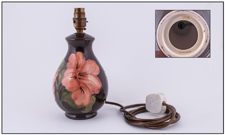 Moorcroft Lamp Base `Coral Hibiscus` Design, on Chocolate brown ground. Stands 10.25`` in height.