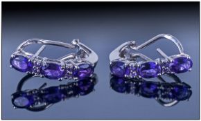 Pair of Amethyst J-Hoop Earrings, the amethysts, being from Zambia, have a rich, deep hue and