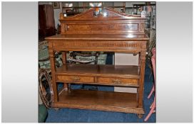 Late 19th Century Pollard Oak Dining Room Serving/Buffet Table, with a shaped pediment top below