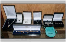Small Collection Of Silver Jewellery. Comprising modern bracelet and padlock, three pendants with