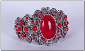 Scarlet Howlite Cabochon Cuff Bangle, the hinged bangle, 2.25 inches at widest, centred by a large