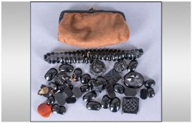Purse Containing Whitby Jet fragments of Jewellery and buttons and bracelets.