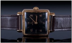 Gents 9ct Gold Rolex Wristwatch, Reference 1164. Square black dial with gilt Arabic and baton