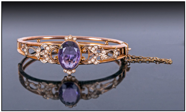 Victorian 9ct Gold Amethyst And Seed Pearl Hinged Bangle, with safety chain. A large faceted