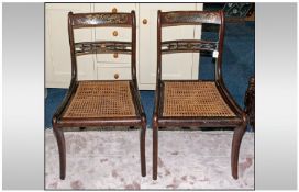 Pair Of Regency Rosewood Library Chairs, with cane seats, the top back rail inlaid with brasswork.