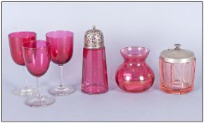 Three Ruby Glass Stemmed Wine Glasses together with a collection of ruby glass including vase,