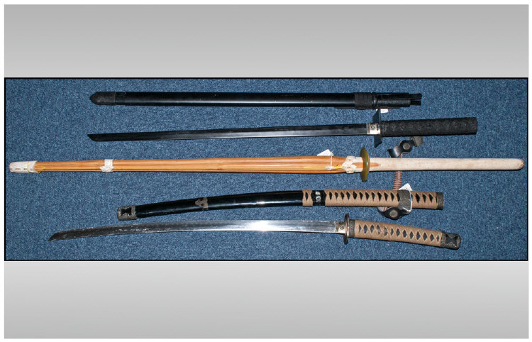 Display Purposes Only. Collection Of two Japanese fantasy samurai swords and a Japanese bamboo