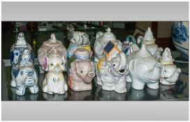 Collection of 12 Pottery Novelty Teapots. All in the style of Elephants various shapes and Sizes.