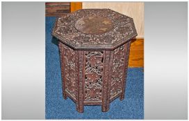 Small Carved Indian Brass Inlaid Tea Table, the top supported by a carved octagonal frame,