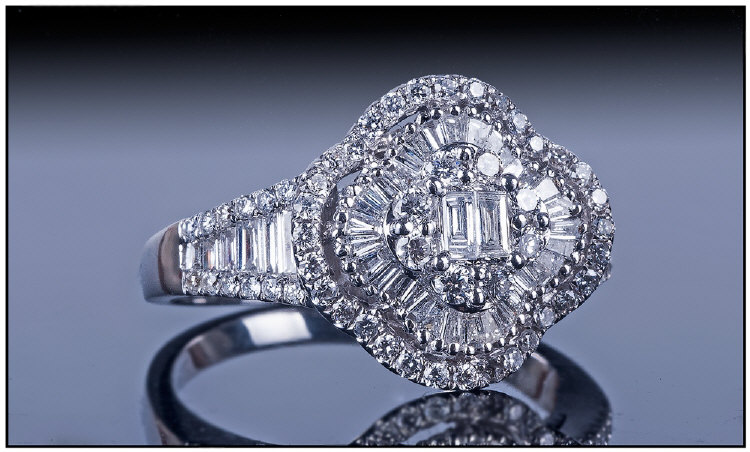 Ladies 18ct White Gold Diamond Cluster Ring, Set with a cluster of 2 central baguette cut diamonds