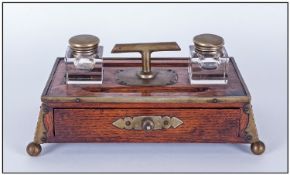 Wooden Inkwell decorated with brass border & handles.