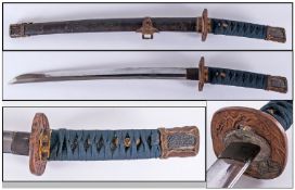 Japanese Sword (Wakizashi). With engraved scabbard depicting a snake, rabbit, rocks and floral