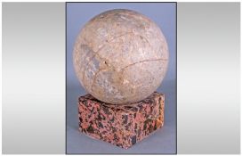 Beige Marble Sphere on a Square Pink Mottled Base. 14 Inches overall height.