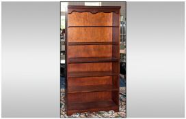 A Tall Mahogany Bookcase with 6 Shelves and shaped top. 72 inches high and 36 inches wide.