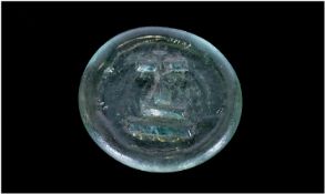 A Rare And Unusual Moulded Glass Dump Seal Device, with a slight blue/green tinge, depicting a