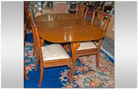 Walnut Queen Anne Leg Drop Leaf Table with Oval shaped Leaves with a set of four Chippendale Style