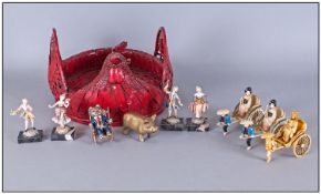 Red Wicker Rooster Egg Basket, containing small miniature figures and a small model of a brass pig.