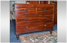 A Victorian Mahogany Chest with two short drawers above two graduating drawers. On two turned legs