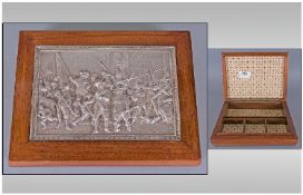 A Fitted Wooden Lidded Box With A Silvered Metal Plaque To The Top, depicting soldiers. Width 8