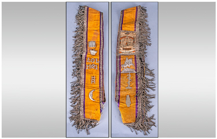 A Rare Orange Order Sash, with attached symbolic emblems relating to the orange order dated 1921.