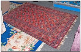 Authentic Turkish Wool Rug 50 by 77 inches. Predominantly red in colour.