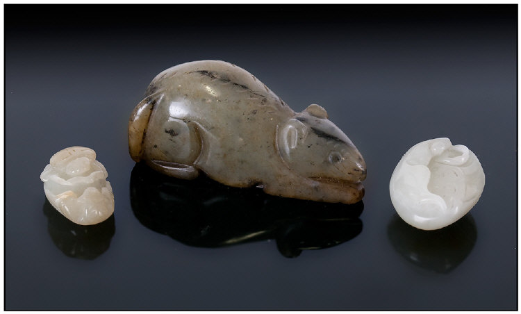 Chinese Green Jade Figure Of A Rat, together with two jade pendants of fruit and insects.