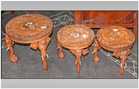 Set Of Three Indian Teak Graduated Tables, carved and inlaid to the top in ivory and stained woods,