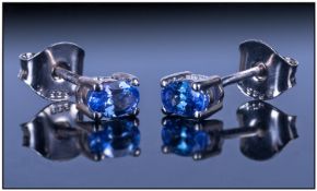 Pair of Tanzanite Stud Earrings, each an oval cut solitaire with a post and push back fitting; the