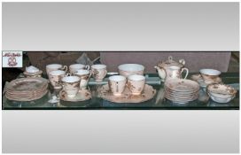 A Partial Noritake Tea Set. Comprising of Teapot, Milk Jug, Cream Jug, cups & saucers, side plates.