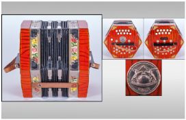 Scholer Concertina In Original Box, decorated with floral resign & red wooden effect.