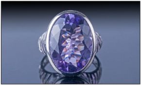 Designer Brazilian Amethyst Cocktail Ring, the oval, faceted stone of approximately 8cts, bezel set