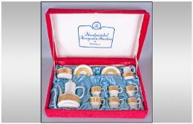 Handpainted Hungarian Porcelain Coffee Set in Original Packaging. Gilt Decoration on White Ground.