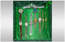 Hinged Velvet Box, containing 10 fashion watches. Manual wind quartz.