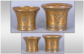 Pair Of Antique Middle Eastern Brass Engraved Drinking Cups, engraved to the body with floral