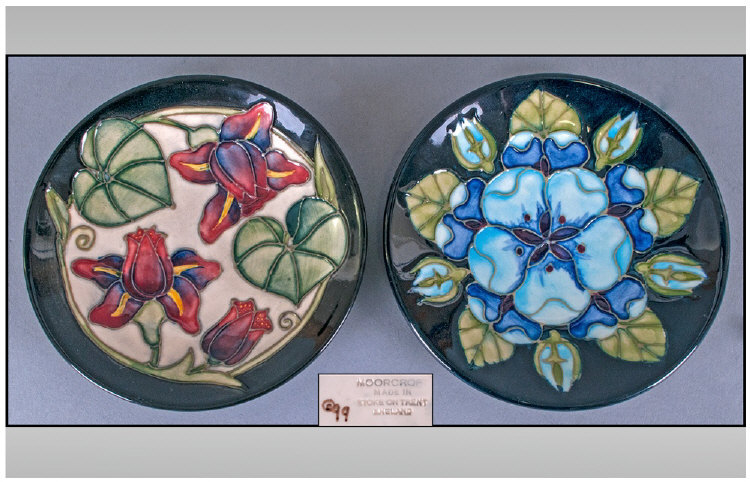 Moorcroft Pair Of Modern Circular Pin Dishes, floral decoration, dates 1999. Each 4.5 inches in