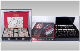 Star Wars Episode 1 Chess Set. Boxed. One piece missing saber. Together with cased Mah Jong set.