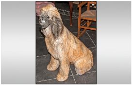 A Large Porcelain Figure of an Afghan Hound Dog. Height 34 Inches High.