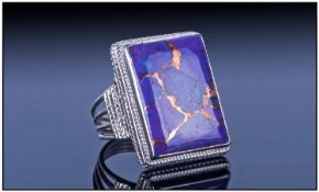 Mojave Purple Turquoise Solitaire Ring, a rectangular cut cabochon of 15.7cts set in a hand made