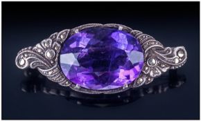 Edwardian Silver Amethyst And Marcasite Brooch. The large faceted amethyst of excellent colour.